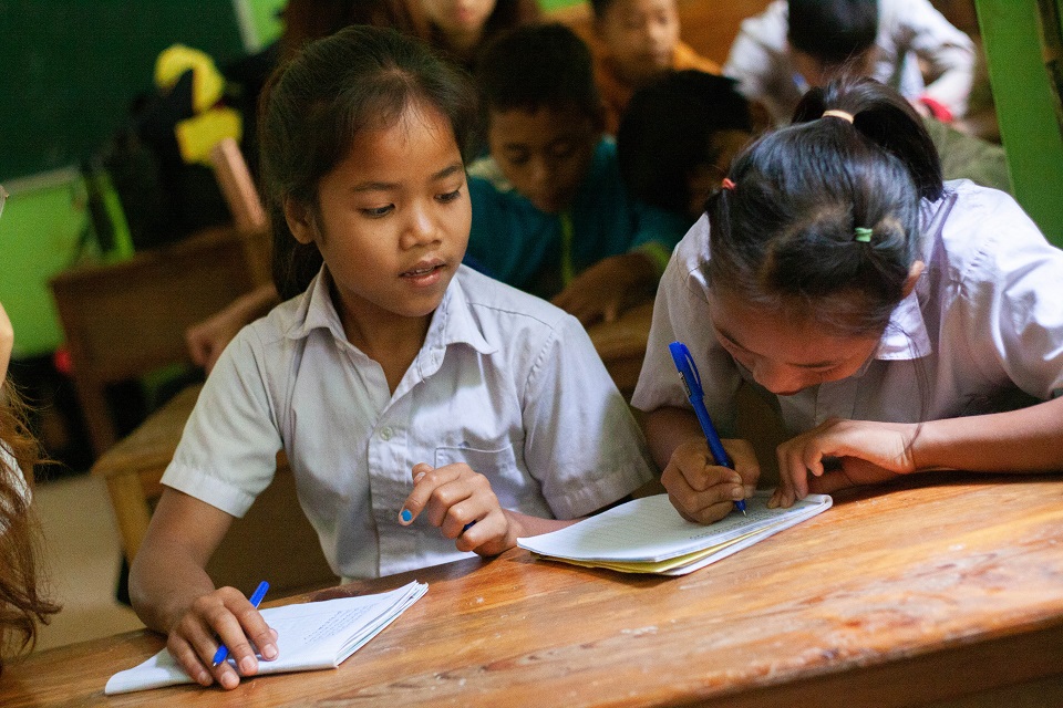 Hard at work taking notes during one of their English classes.