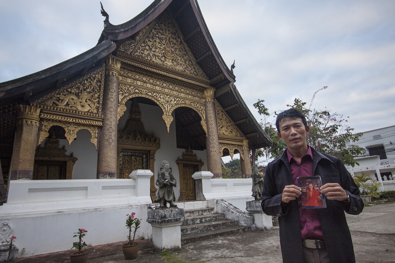 Mr Bounleua Sinthavong, 35, and a photo of himself when he was a novice monk.