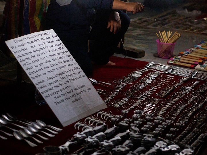 Stalls selling metal war souvenirs from unverified sources are a common sight in Luang Prabang’s night market.