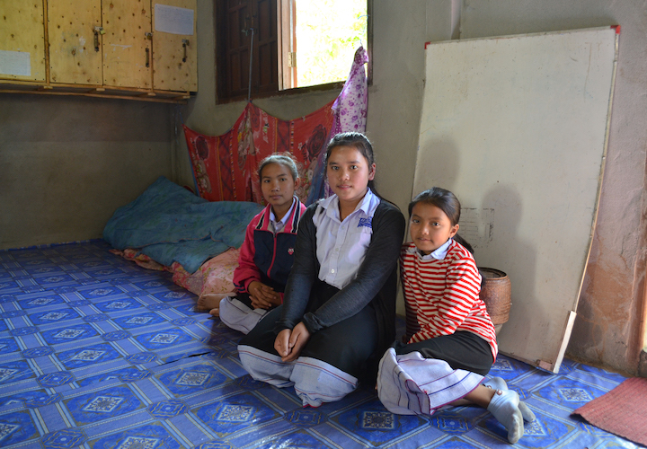 Due to a lack of bedrooms, the girls sleep in the living room on mattresses. 