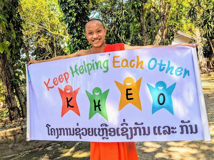 Founder Monk Obee with KHEO’s banner.